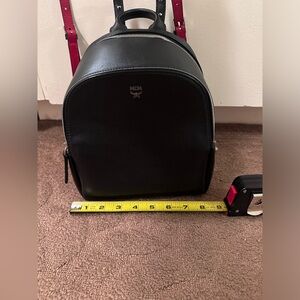 Authentic MCM small black backpack with studs preloved pristine condition
